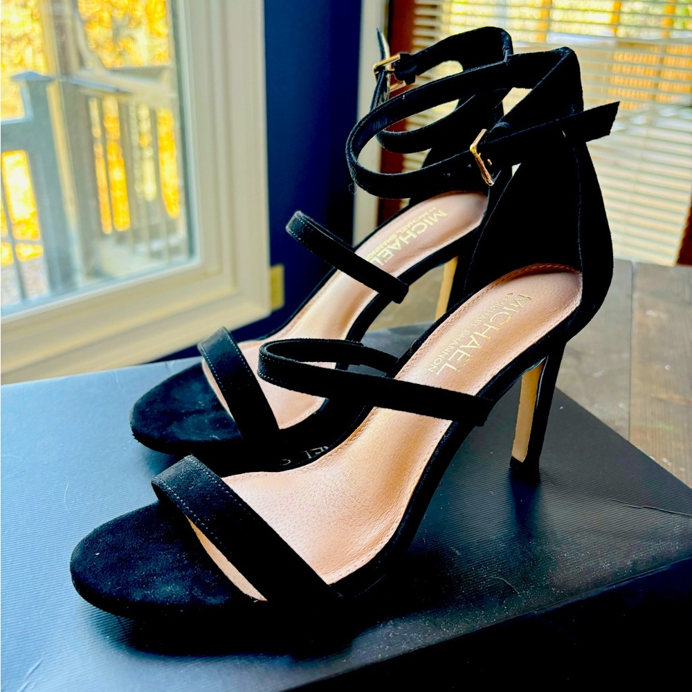 Black suede strap high heels.